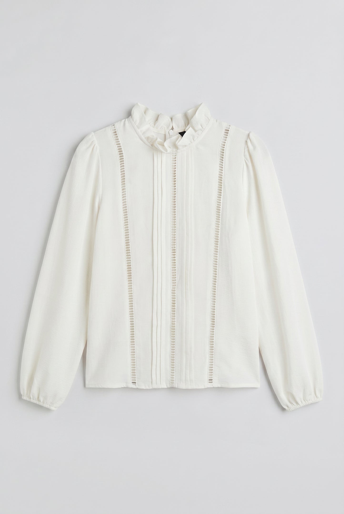 White blouse with openwork trims