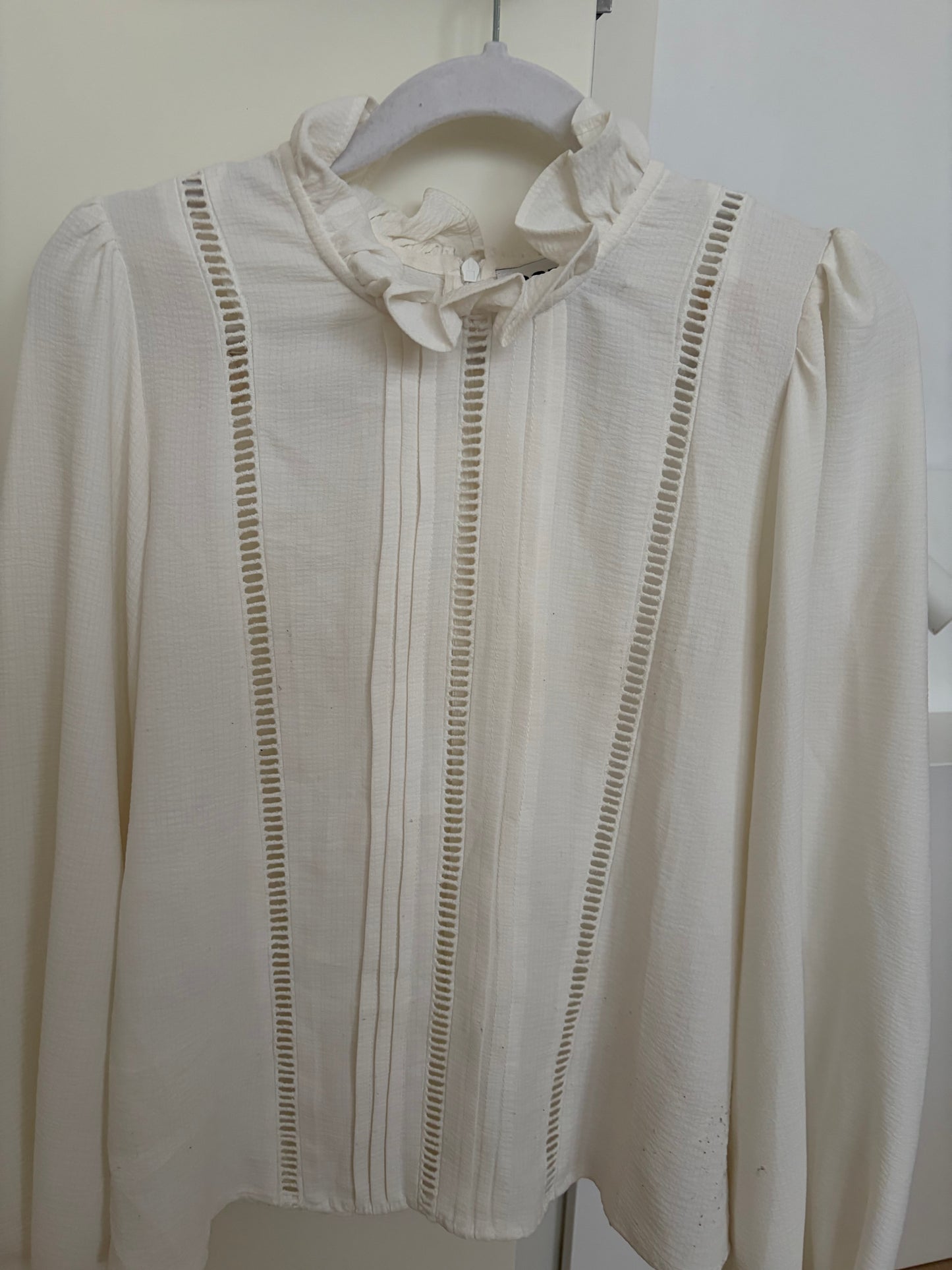 White blouse with openwork trims