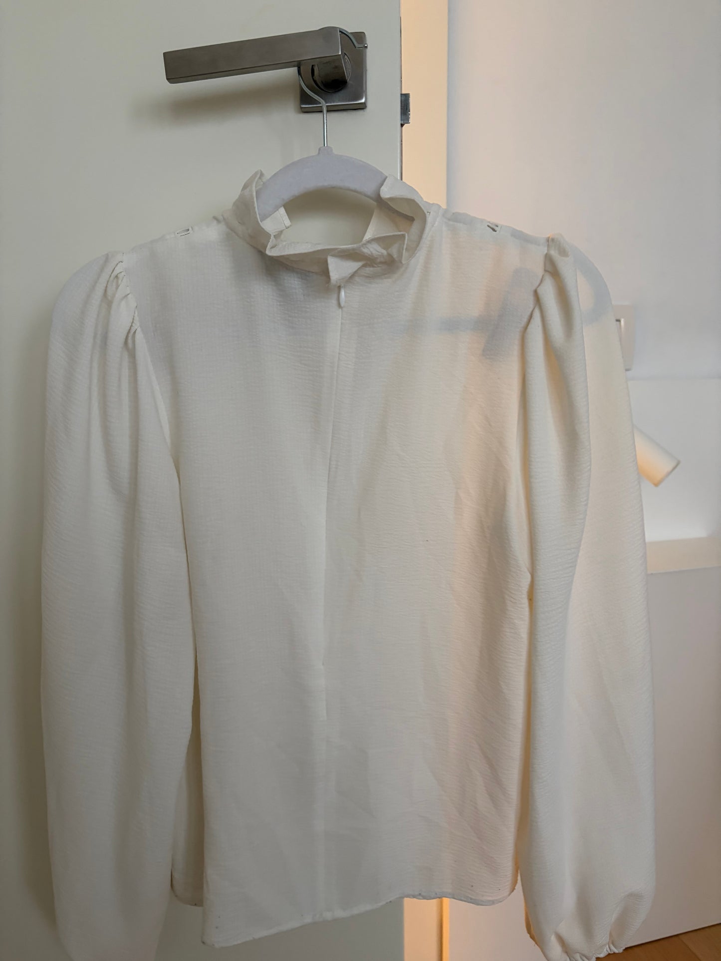 White blouse with openwork trims